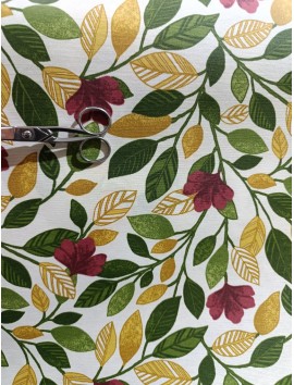 Mantel resinado , teflón , ramas verdes , granates y mostaza