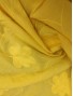 Batista amarilla de algodón con flores color