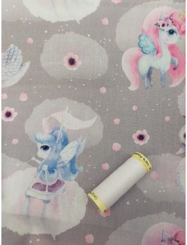 Tela de algodón unicornios rosas y azules fondo gris
